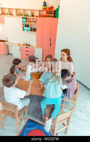 Top view of happy nice kids during the lesson Stock Photo