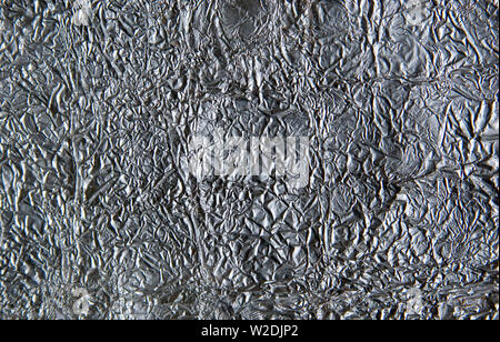 Close up of crumpled Aluminium (Aluminum) foil. Stock Photo