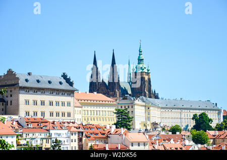 Amazing view of Prague Castle and St. Vitus Cathedral in Prague, Czech Republic photographed on a clear day with historical buildings around the castle. Czech capital, tourist place. Bohemia, Czechia. Stock Photo