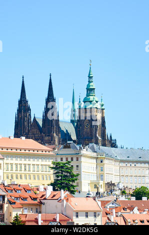 Vertical photo of famous Prague Castle and St. Vitus Cathedral in Prague, the capital of Czech Republic. Beautiful historical buildings around the castle. Famous tourist landmark. Travel destination. Stock Photo