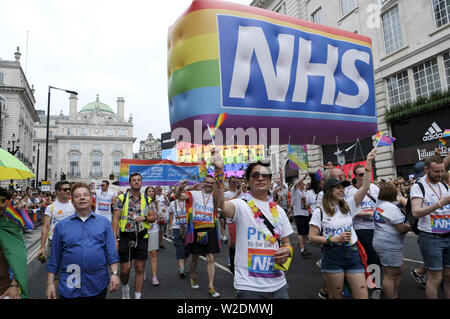 London, Greater London, UK. 6th July, 2019. NHS Staff march with a huge NHS rainbow inflatable during the Pride parade.Thousands of revellers filled London's streets with colour to celebrate Pride in the capital city. 2019 marked the 50th anniversary of the Stonewall riots in New York City, seen as the origin of Pride and the LGBT  rights movement. Credit: Andres Pantoja/SOPA Images/ZUMA Wire/Alamy Live News Stock Photo