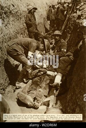 Wounded soldier being treated in the trenches, Battle of the Somme, First World War, 1916, (1935). Creator: Unknown. Stock Photo