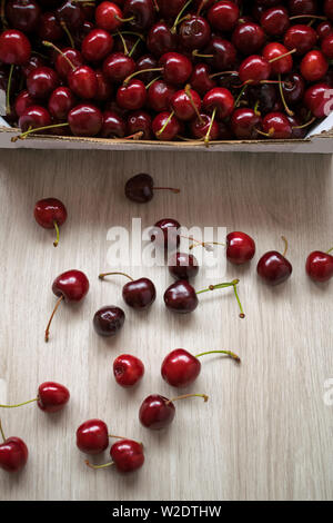 Ripe cherries on a wooden table Stock Photo