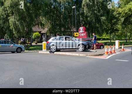 A3 2.0 T3 Audi car crash on roundabout, demolishes sign post. Stock Photo