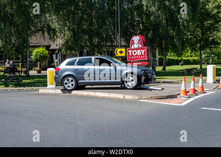 A3 2.0 T3 Audi car crash on roundabout, demolishes sign post. Stock Photo