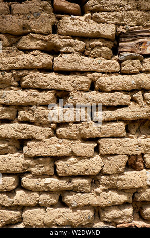 Background of old wall made of adobe or mudbrick masonry. Stock Photo