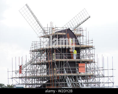 Brill, Aylesbury, Buckinghamshire, UK. 8th July 2019. The Grade-II listed 17th century post mill on Brill hilltop gets a new lick of paint on a day of sunny spells. Credit: Angela Swann/Alamy Live News Stock Photo