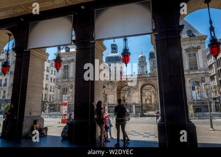 Monumental City Hall at the Place des Terreaux seen through the arches of the Opera house, Lyon, France Stock Photo