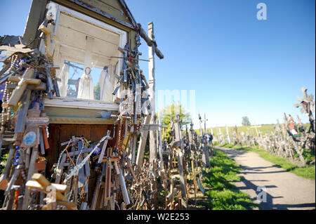 SIAULIAI, LITHUANIA - JULY 30, 2018: Various wooden crosses and crucifixes on the Hill of Crosses, a site of pilgrimage near Siauliai, Lithuania. Stock Photo