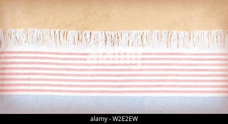 Beach towel on sand background Stock Photo