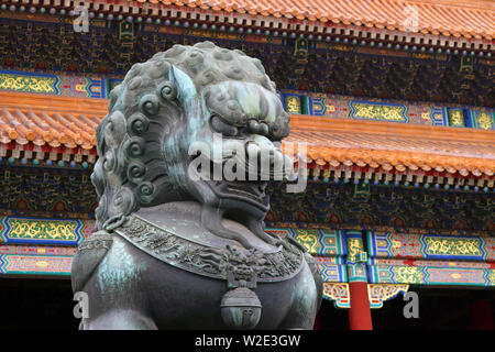 Statue of a bronze lion inside the forbidden city in Beijing, China. An ancient Historical Famous Building. Stock Photo