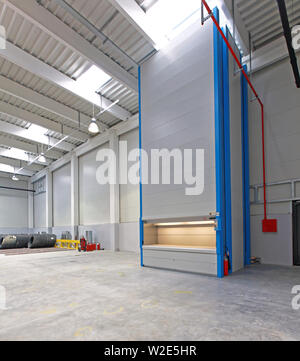 Vertical Carousel Storage Unit in Distribution Warehouse Stock Photo