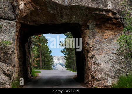 Mount Rushmore framed by tunnel on Iron Mountain Road in the Black Hills of South Dakota, USA Stock Photo