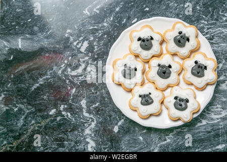 Eid Ad-Adha Mubarak holiday concept - cookies shaped like sheeps Stock Photo