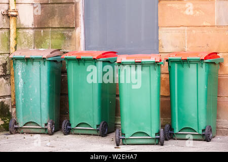 Green wheelie bins in row uk Stock Photo