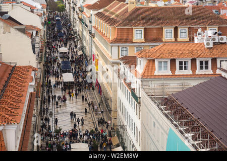 Aerial view from the Arco da Rua Augusta of the pedestrianised commercial street of Rua Augusta, in Lisbon, Portugal busy with shoppers and tourists. Stock Photo