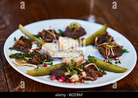 Close up of roasted beef liver on plate Stock Photo