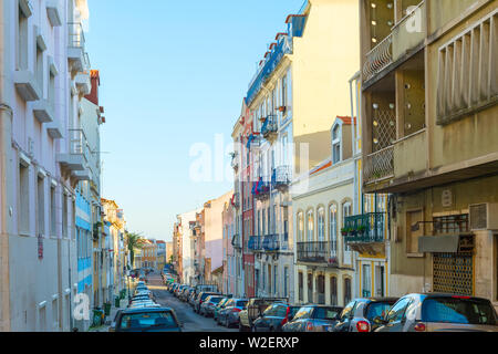 Cars parked at Old Town street of Lisbon, Portugal Stock Photo