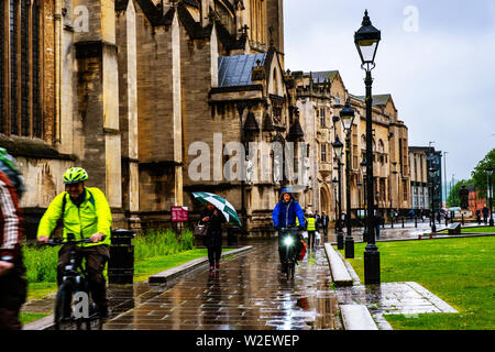 BRISTOL, UK - MAY 17, 2017: People in the center of Bristol, UK during the rainy day. Bright cloudy sky. Cathedral and historical buildings Stock Photo