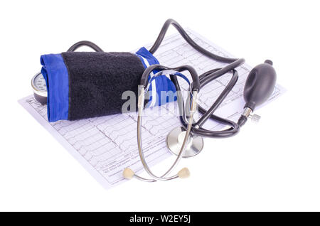 Analog blood pressure meter (tonometer) and notepad on the background of medical graphs, diagnostics. Healt concept. Stock Photo