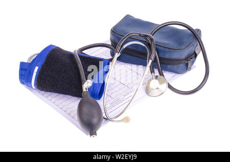 Analog blood pressure meter (tonometer) and notepad on the background of medical graphs, diagnostics. Healt concept. Stock Photo