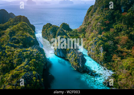 Aerial drone view of entrance to Big and Small Lagoon surrounded by steep cliffs El Nido, Palawan Philippines Stock Photo