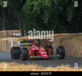 Racing car speeds up the hillclimb at the Goodwood Festival of Speed (2019) West Sussex, England, UK Stock Photo