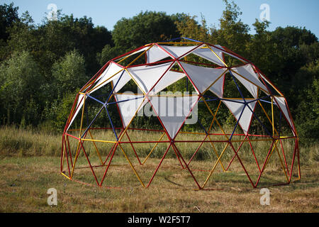 Semispherical design with fabric awnings for relaxing in a meadow near the forest Stock Photo