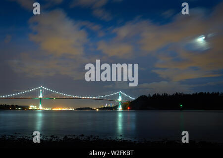 Lions Gate Bridge Vancouver Night. The Lions Gate bridge at twilight. Stanley Park. Vancouver, British Columbia, Canada. Stock Photo