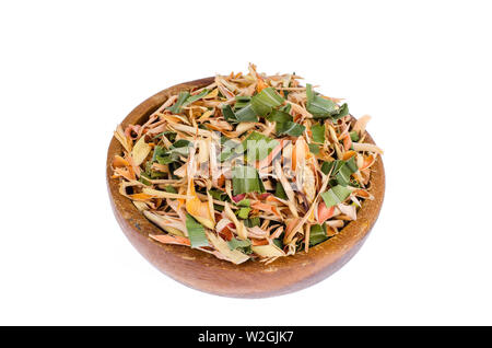 Dried lemongrass leaves in wooden bowl.  Stock Photo