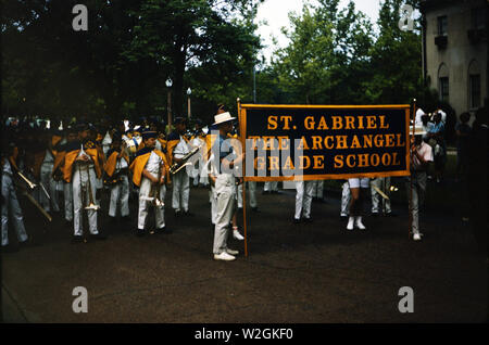 Elementary school band preparing to march in a parade ca. 1963 Stock Photo