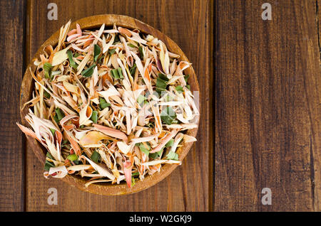 Dried lemongrass leaves in wooden bowl.  Stock Photo