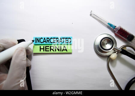 Incarcerated Hernia text on top view isolated on white background. Healthcare/Medical concept Stock Photo