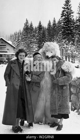 Eva Braun Collection - (album 1) -  Women posing with man dressed in a bear costume ca. 1930s Germany? Stock Photo