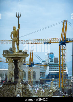 a view on the Port of Naples, Italy, from Municipio Square, with the Fountain of the Neptune in sight. Stock Photo