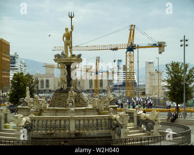 a view on the Port of Naples, Italy, from Municipio Square, with the Fountain of the Neptune in sight. Stock Photo