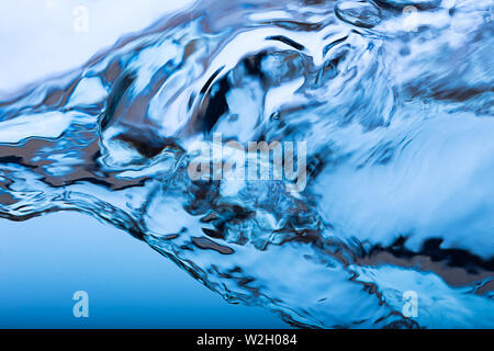 Water splash, clear blue water with waves and bubbless Stock Photo