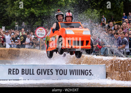 2 Fast 2B Furious team competing in the Red Bull Soapbox Race 2019 at Alexandra Park, London, UK. Jumping over ramp with people, crowds Stock Photo