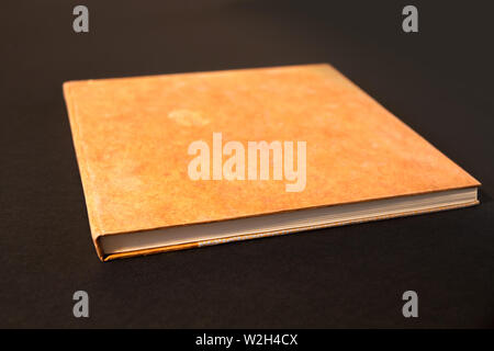 Closed blank notebook mockup, isolated on black Stock Photo