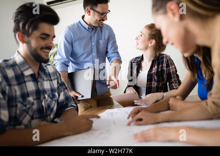 Young architects working on project in office Stock Photo