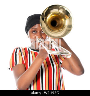 black teen girl with headscarf and musical instrument trombone against white background Stock Photo