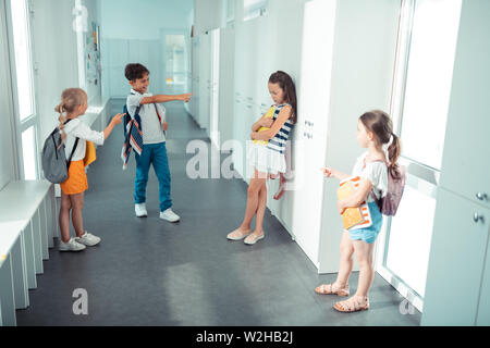 Unhappy schoolboy standing, elementary age children drawing Stock Photo ...