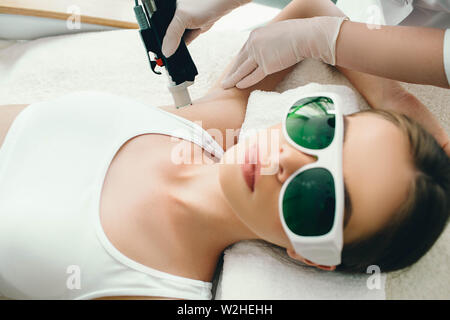 patient getting laser treatment on armpit, close up. Laser hair removing on armpit