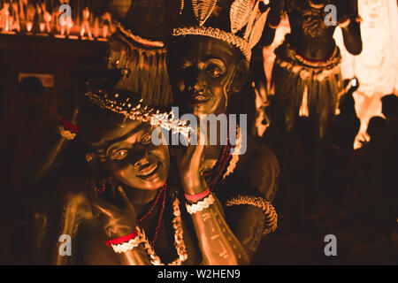 KOLKATA , INDIA SEPTEMBER 26, 2017 - Decorated art and craft sculptures of Traditional tribal Santal or Santhal ethnic group dancers making love wear Stock Photo