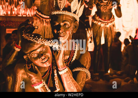 KOLKATA , INDIA SEPTEMBER 26, 2017 - Decorated art and craft sculptures of Traditional tribal Santal or Santhal ethnic group dancers making love wear Stock Photo