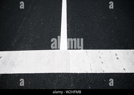 White lines painted on the asphalt. Stock Photo