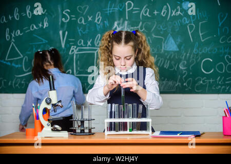 Confident medical experts. childrens day. Little children at school lesson. students doing biology experiments with microscope. Chemistry. Back to school. Little kids learning chemistry in school lab. Stock Photo