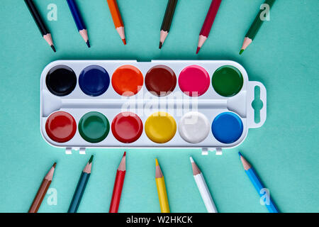 Arrangement of art supplies on color background. Stock Photo