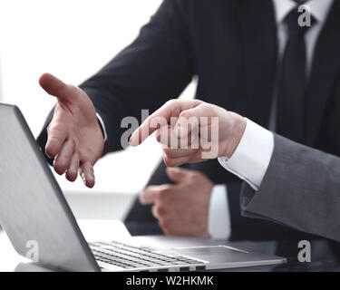 close up. two business people discussing online information Stock Photo