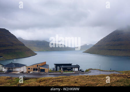 Houses in Klaksvik with view over fjords and mountains in the Faroe Islands Stock Photo